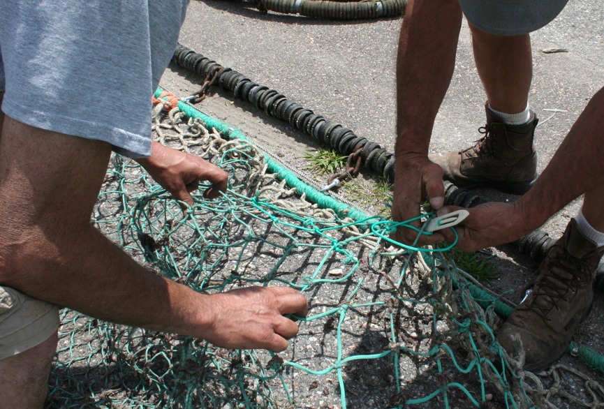 Repairing a net. As seen in Stonington, Connecticut. Moo Dog Knits Magazine.